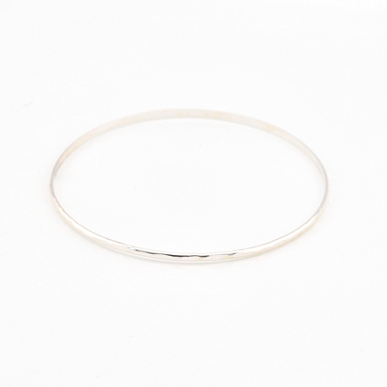 Silver bangle on a white background