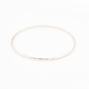 Silver bangle on a white background