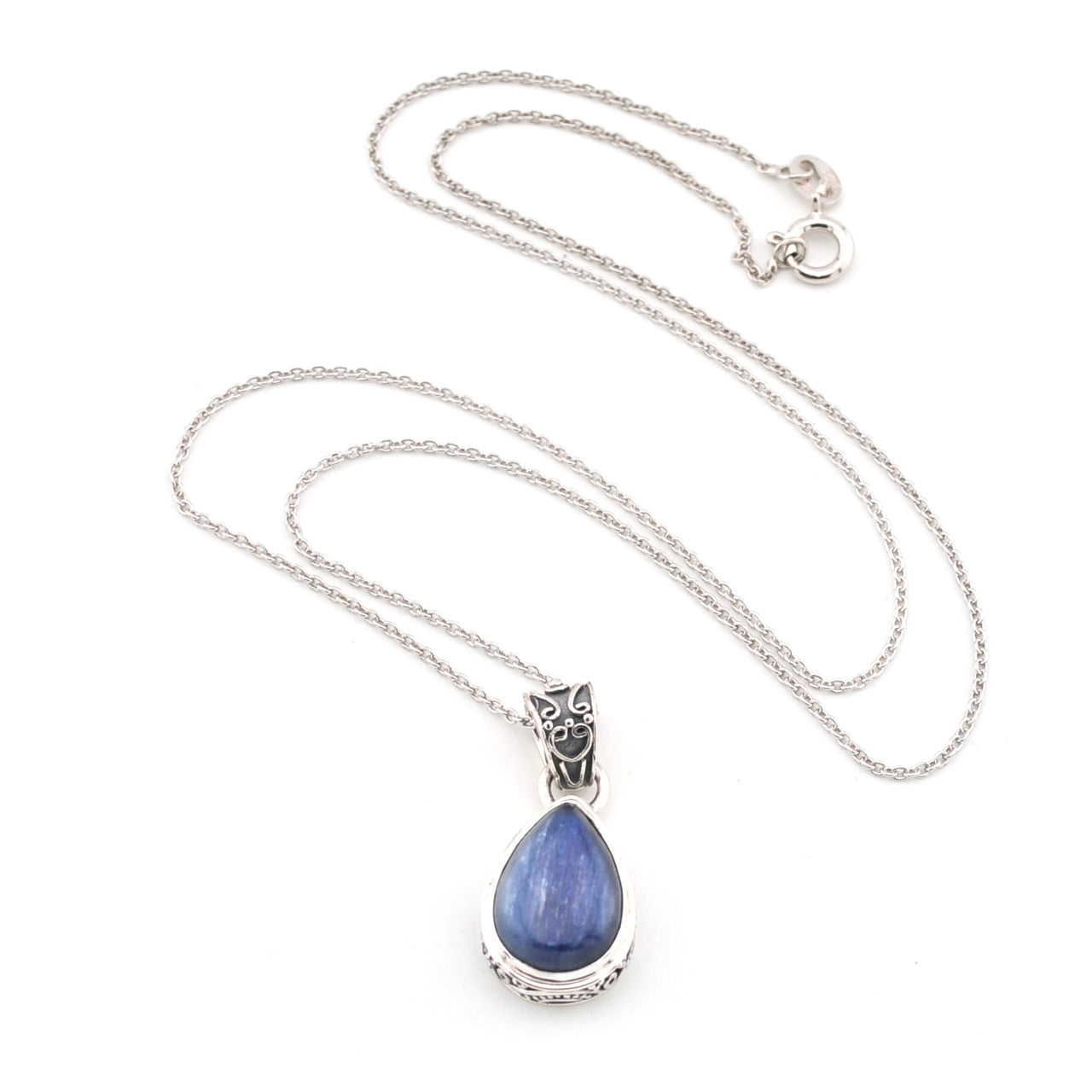 Necklace with a blue kyanite teardrop pendant on a white background