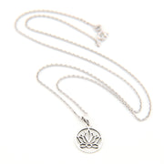 Silver necklace with a lotus flower pendant on a white background