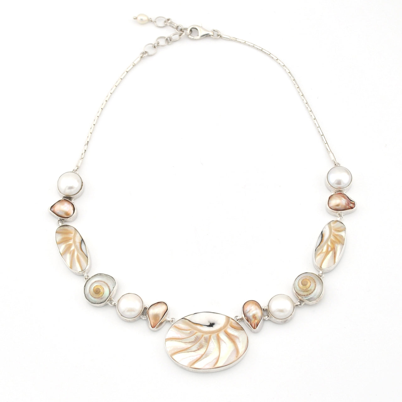 Necklace with shell and pearl beads on a white background