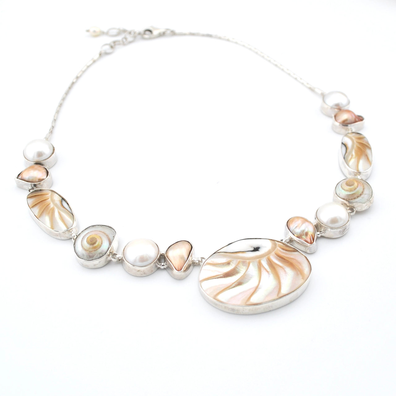 Necklace with shell and pearl beads on a white background