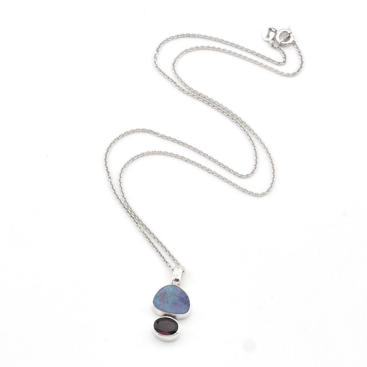 Necklace with a pendant featuring two stones on a white background