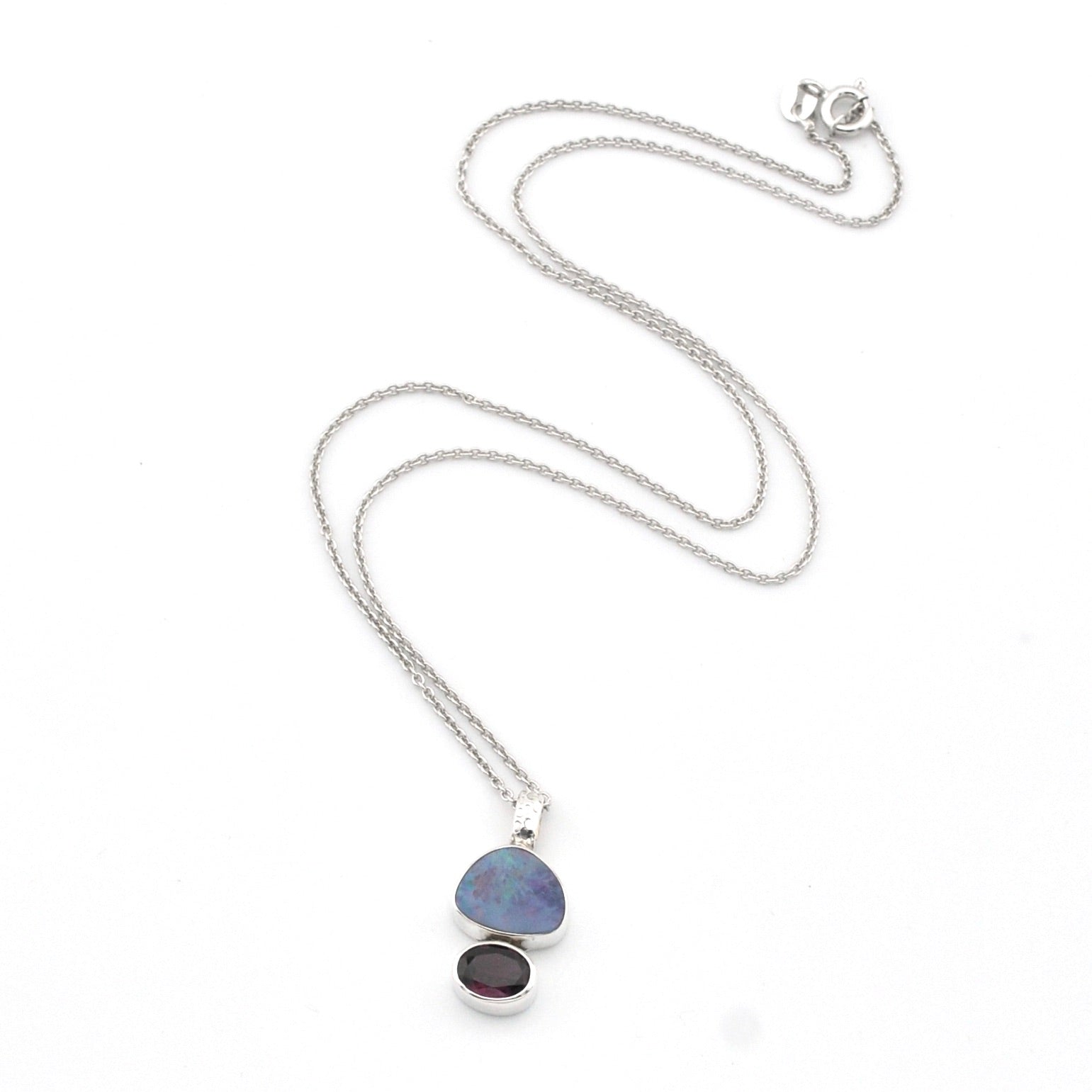 Necklace with a pendant featuring two stones on a white background