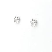 Pair of silver paw print earrings on a white background