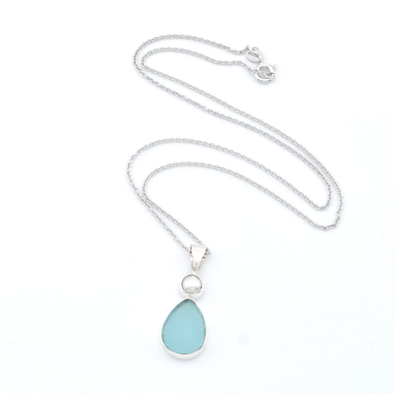 Necklace with a light blue teardrop pendant on a white background