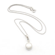 A silver chain necklace with a round white pearl pendant in a polished silver bezel setting, displayed on a clean white background.