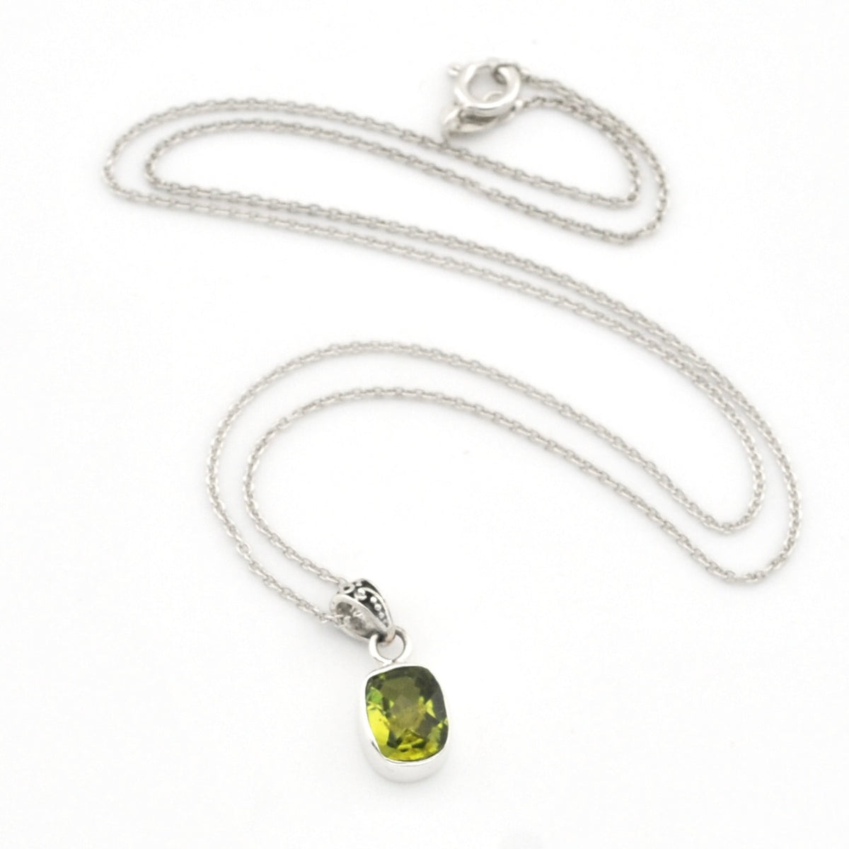 A silver chain necklace with a rectangular green gemstone pendant, displayed on a clean white background.