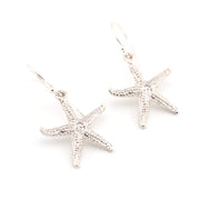 Starfish-shaped earrings on a white background