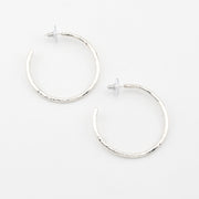 Silver hoop earrings on a white background