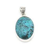 An oval turquoise pendant with a silver-toned bezel and bail, displayed on a clean white background.