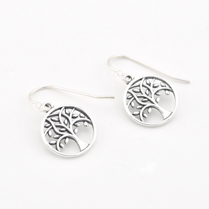 A pair of silver tree of life drop earrings with fishhook wires, displayed on a clean white background.