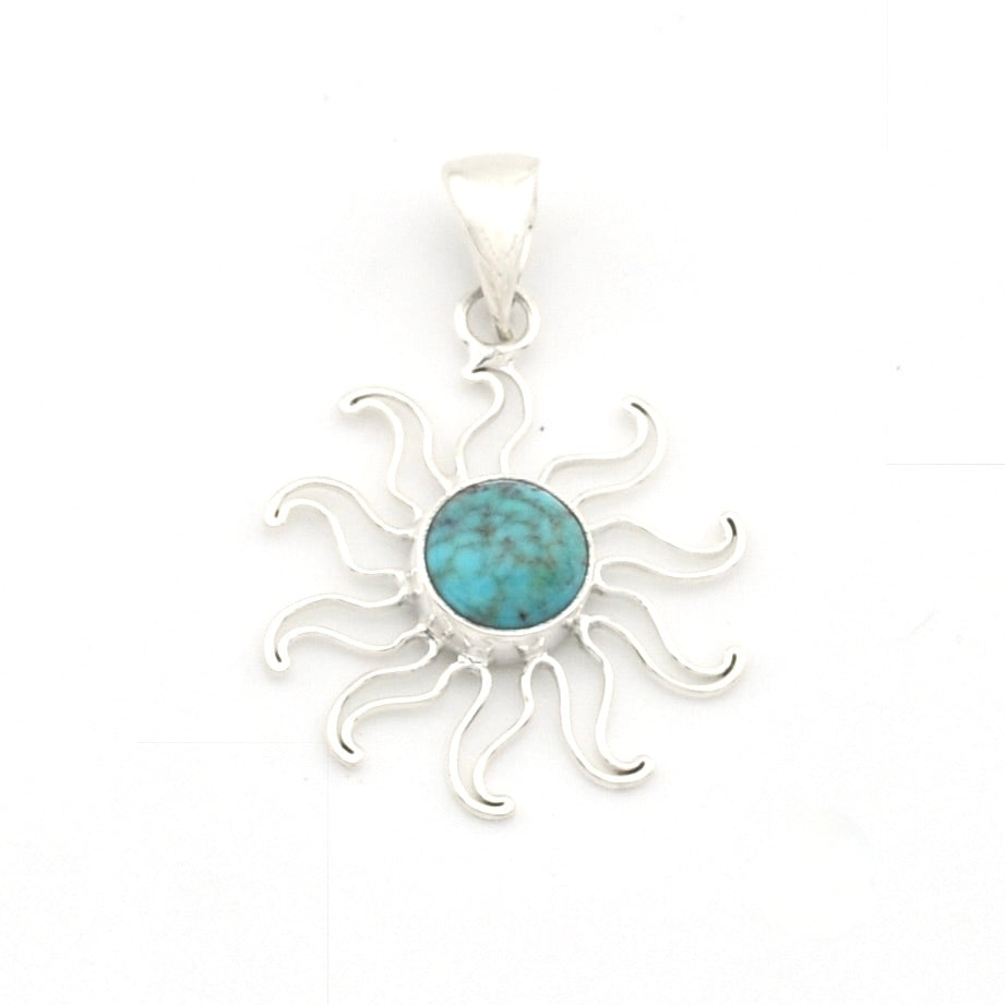 A sterling silver sunburst pendant featuring a round turquoise cabochon in the center, set against a plain white background.