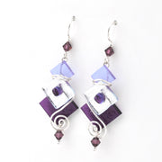 Pair of earrings with purple and silver design on a white background