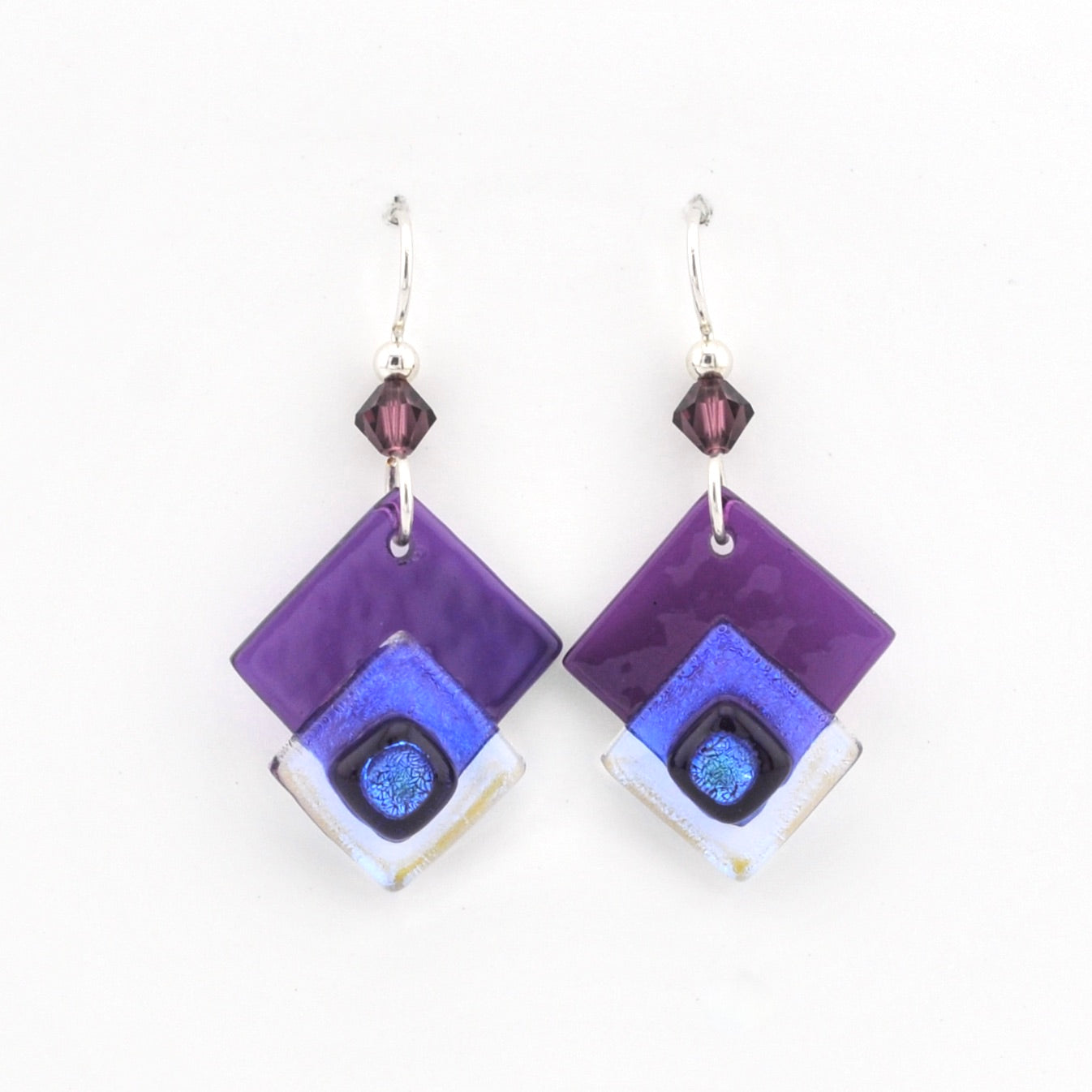 Pair of square-shaped earrings with purple and blue design on a white background