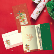 Set of Christmas-themed stationery items on a red background