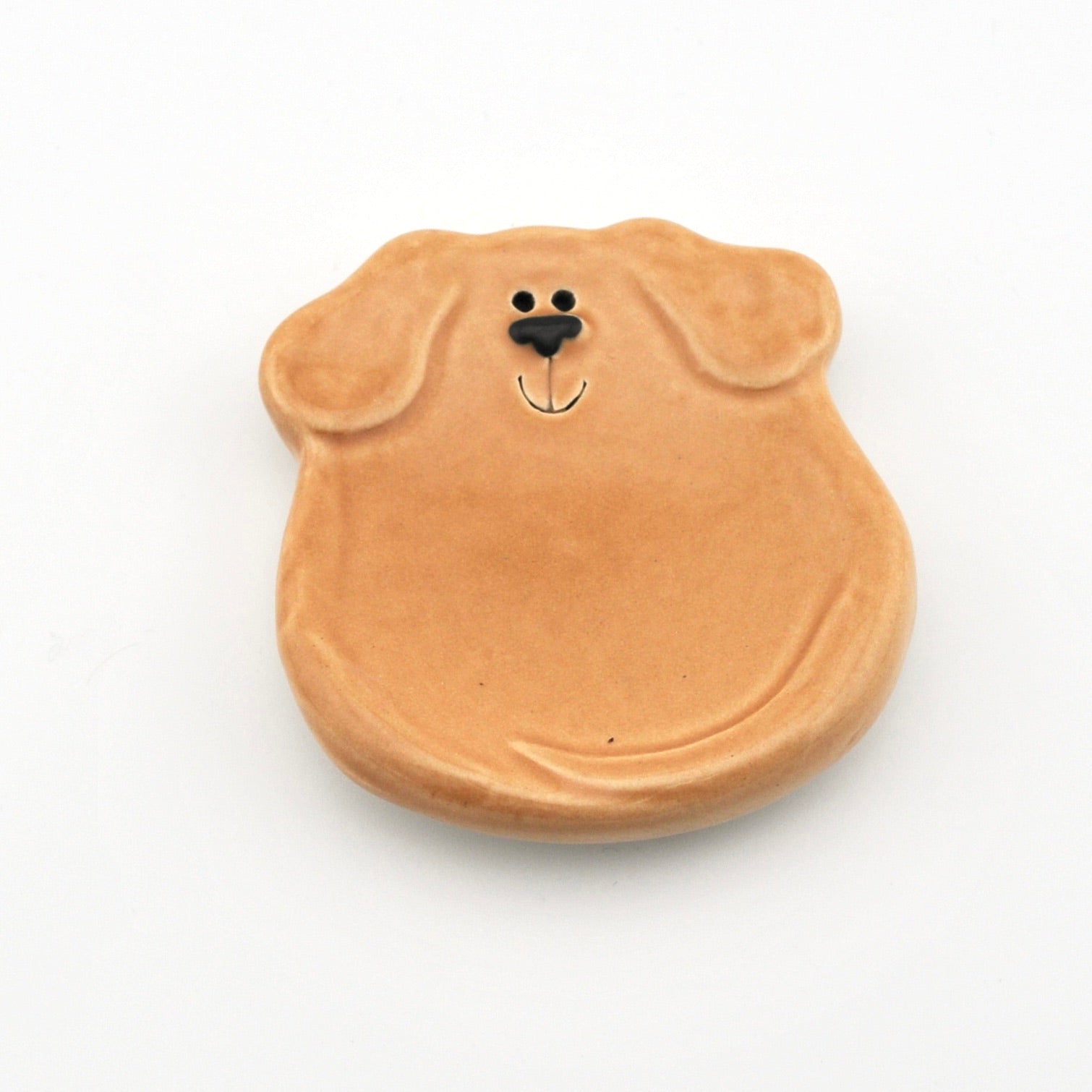 Dog-shaped dish on a white background