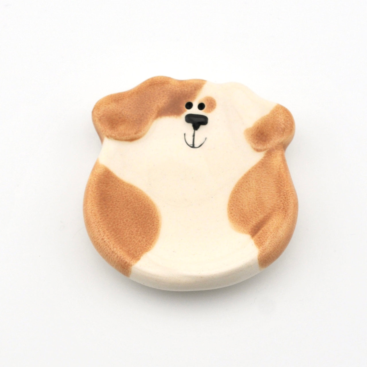Dog-shaped dish on a white background