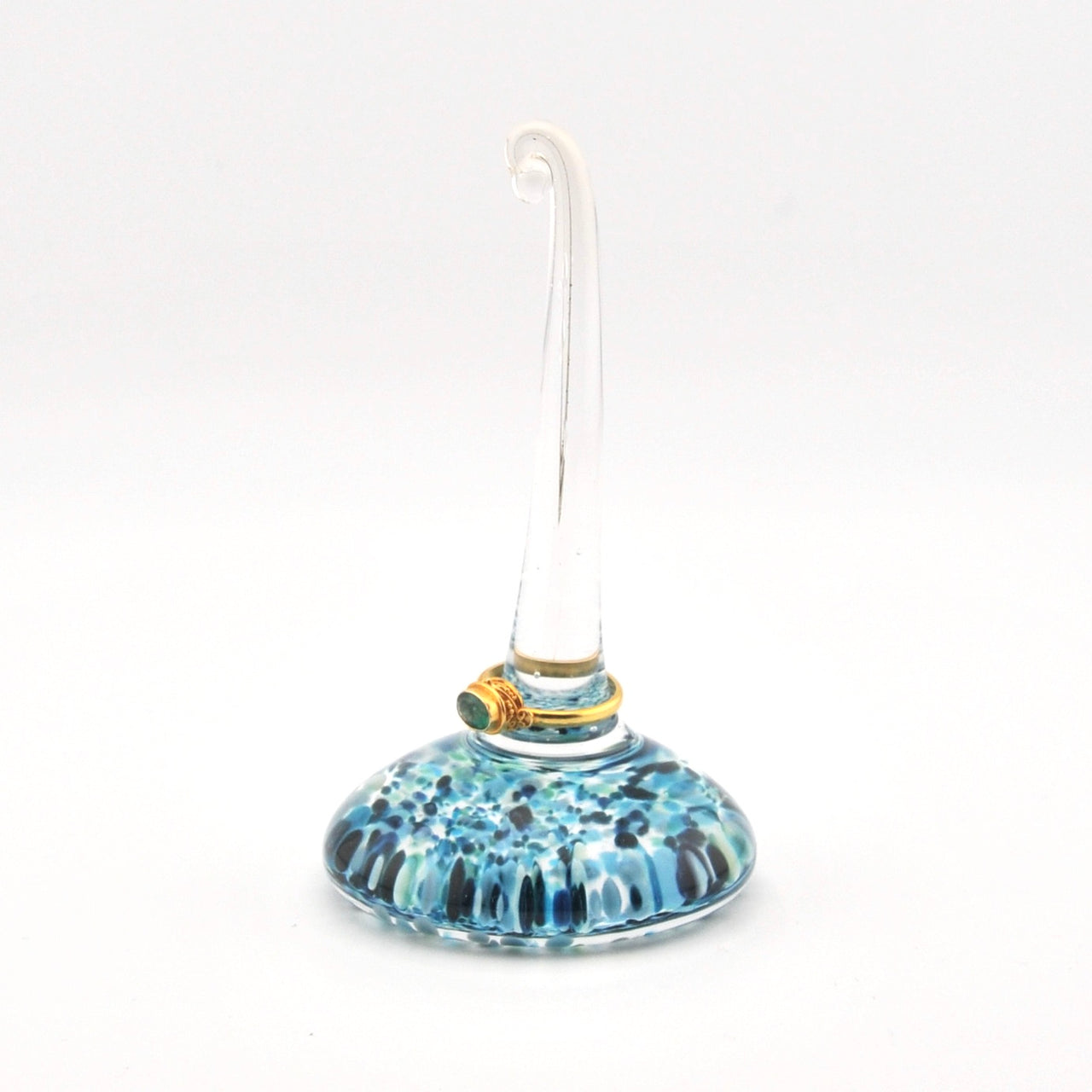 Glass ornament with blue pattern on a white background