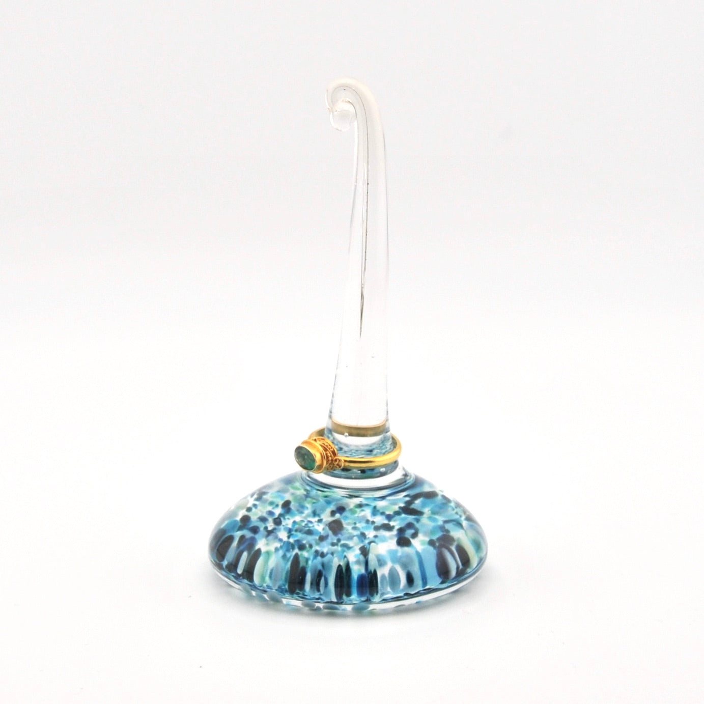 Glass ornament with blue pattern on a white background