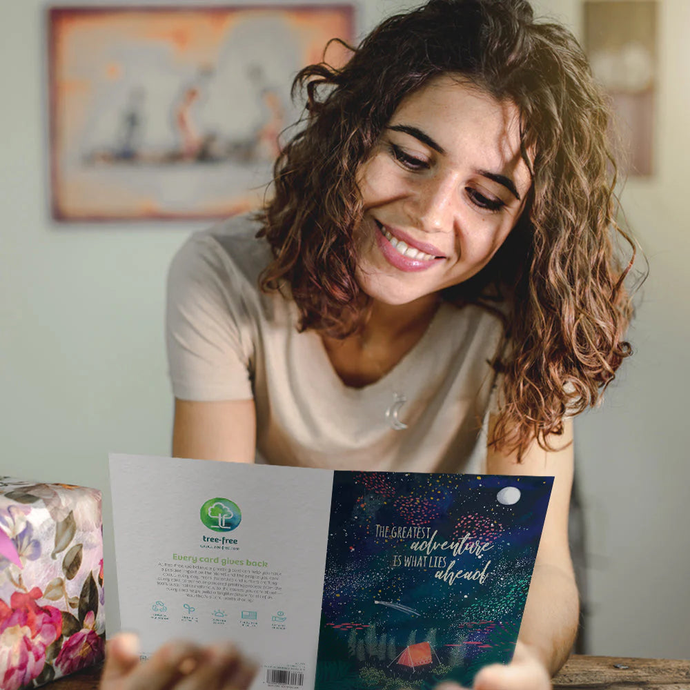 The Greatest Adventure Birthday Card being read by a smiling lady