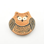 Ceramic owl-shaped dish on a white background