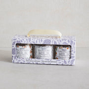 Three milk products in a decorative box on a light gray background