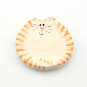 Round ceramic dish with cat design on a white background