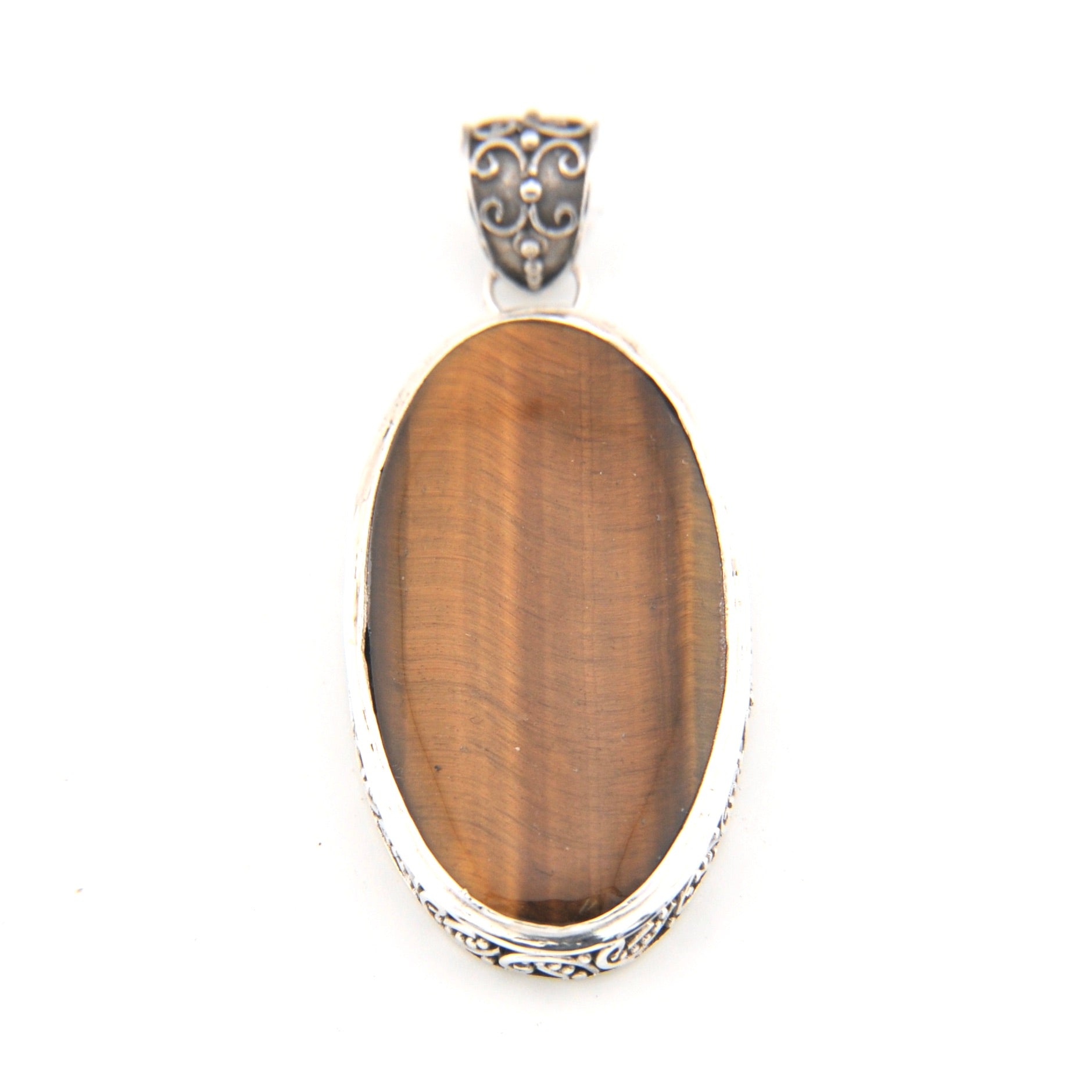 Pendant with brown oval stone and silver frame on a white background