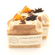 Bar of soap with star anise and orange peel on top, labeled 'Comfort & Joy'.