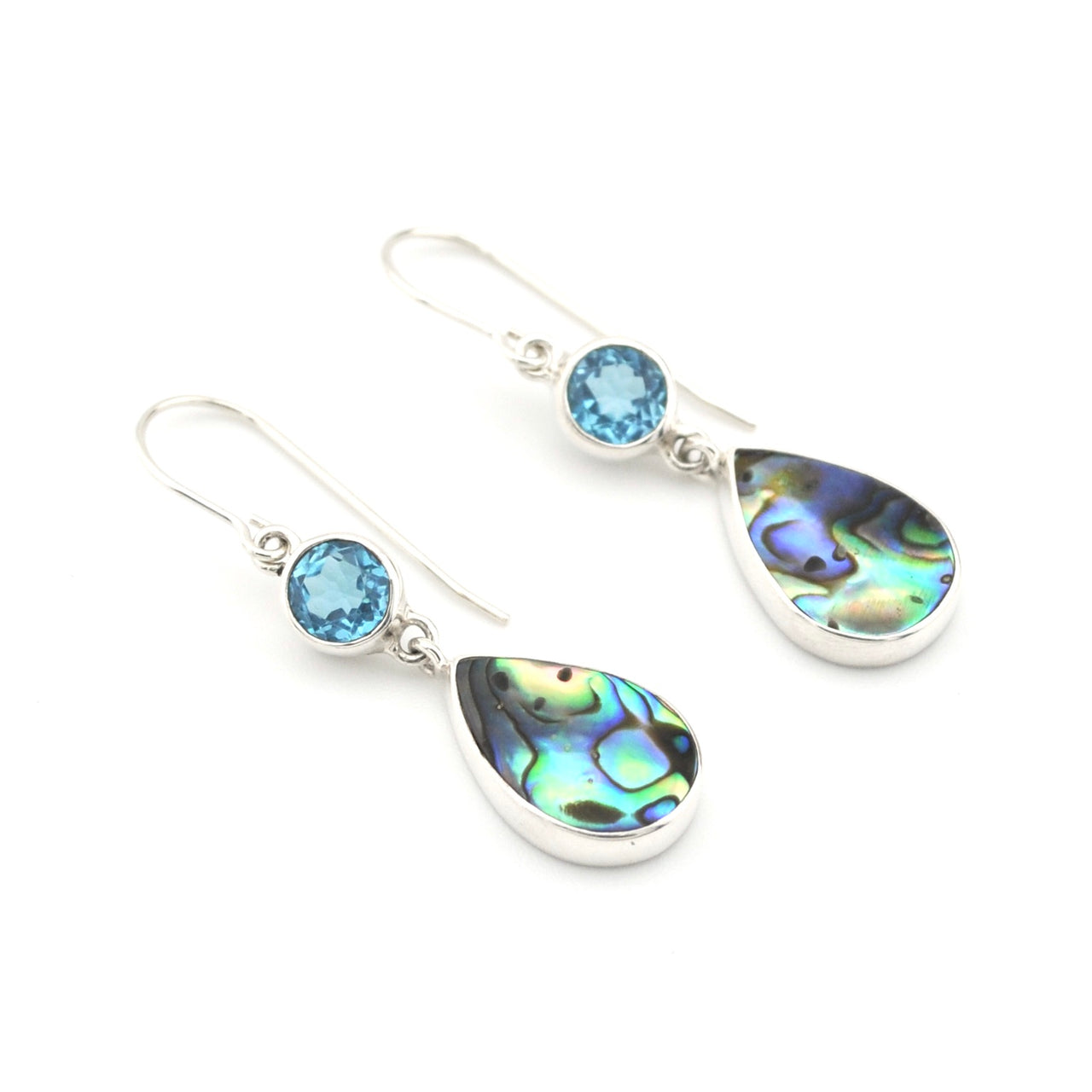 Pair of earrings with teardrop-shaped gemstones on a white background