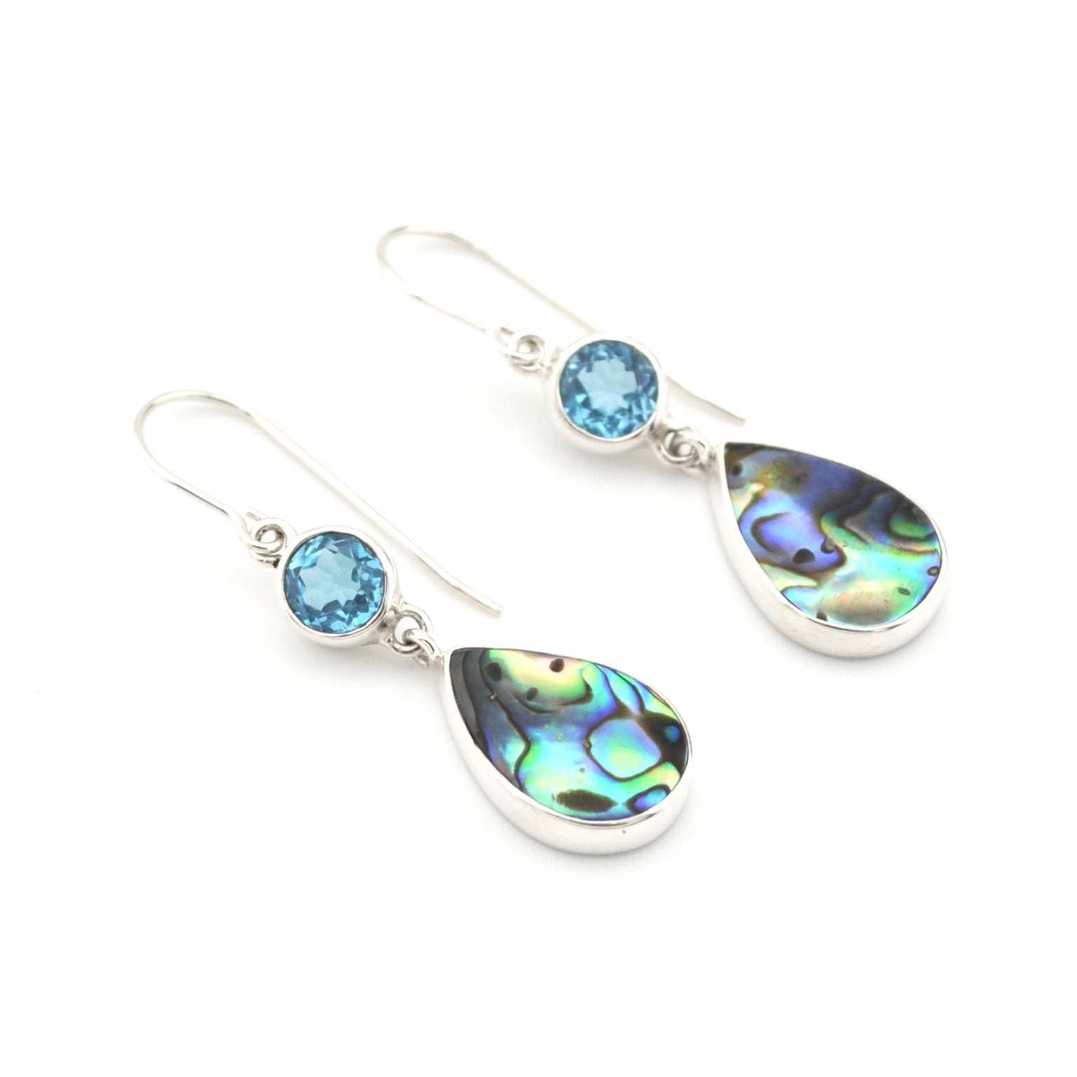 Pair of earrings with teardrop-shaped gemstones on a white background