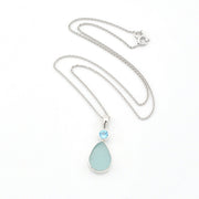 Necklace with a teardrop-shaped pendant on a white background