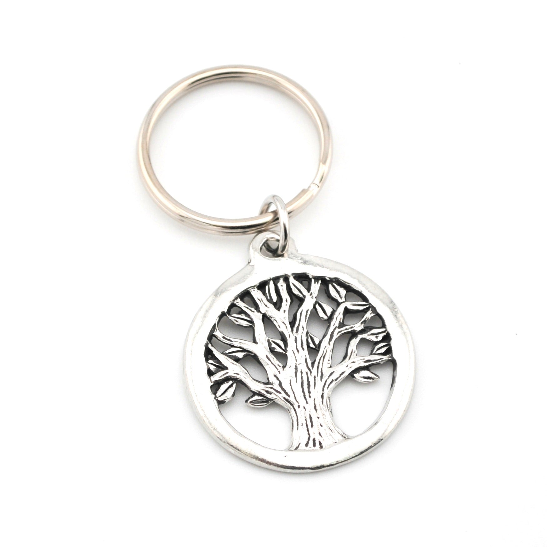 Silver keychain with tree of life design on a white background
