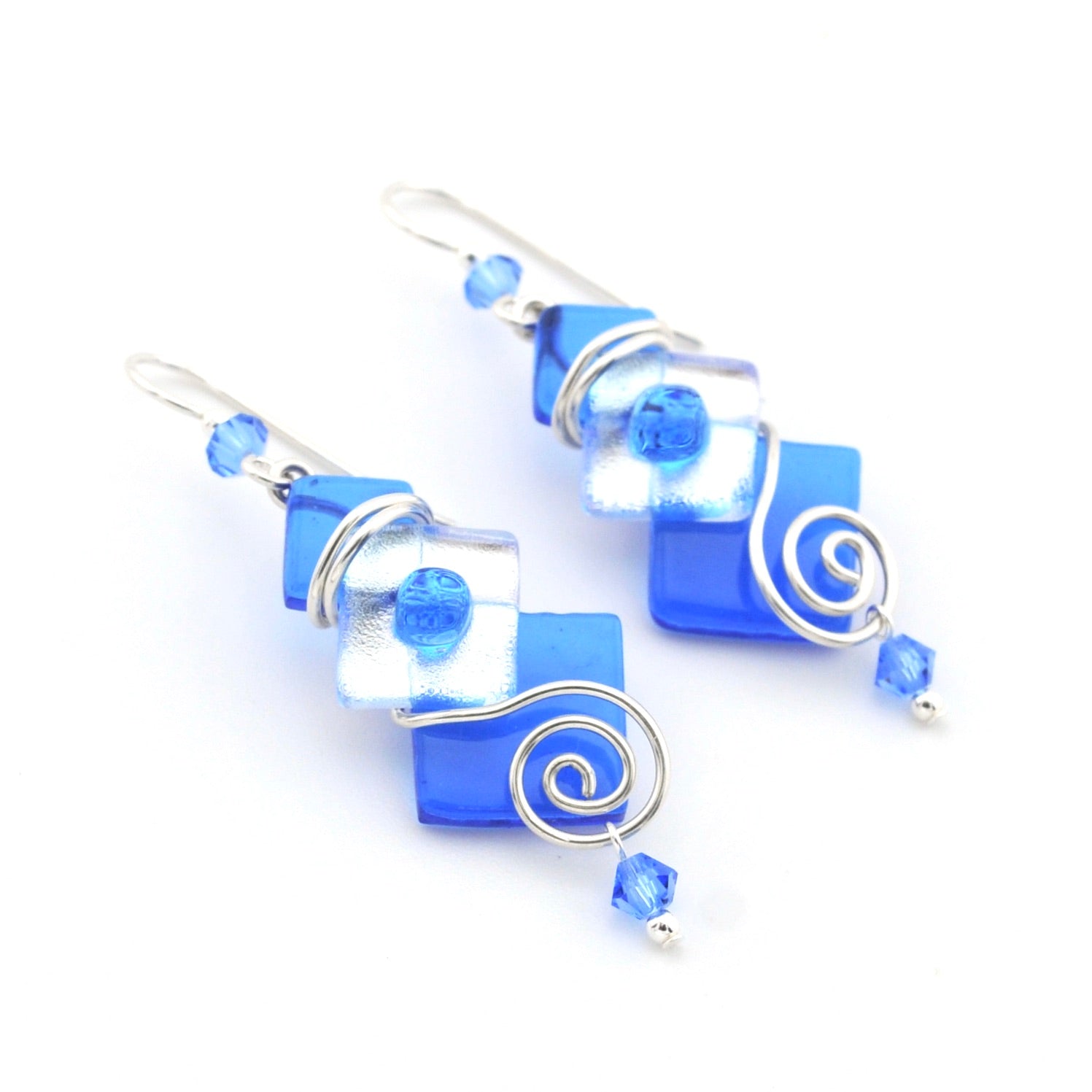 Blue square glass earrings with silver wire wrapping on a white background