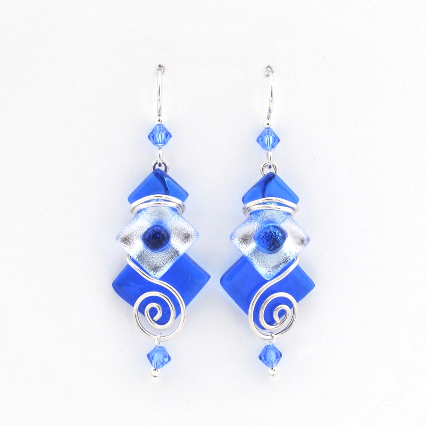 Blue and silver earrings on a white background