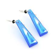 Blue glass dangle earrings on white background.