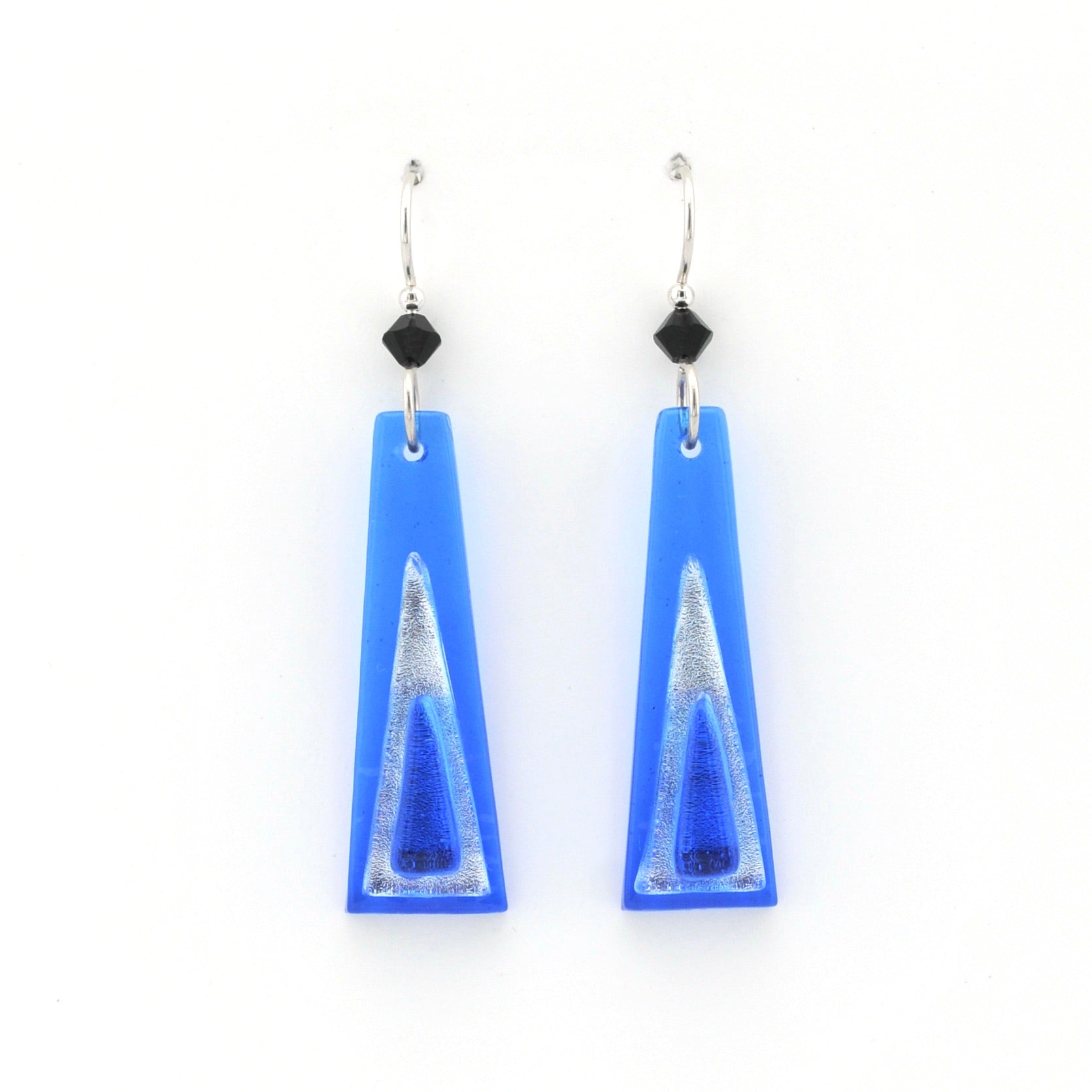 Blue glass earrings on white background