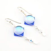 Pair of earrings with blue and white gradient stones on a white background