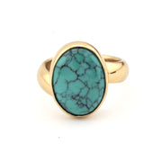 Turquoise ring with gold on white background