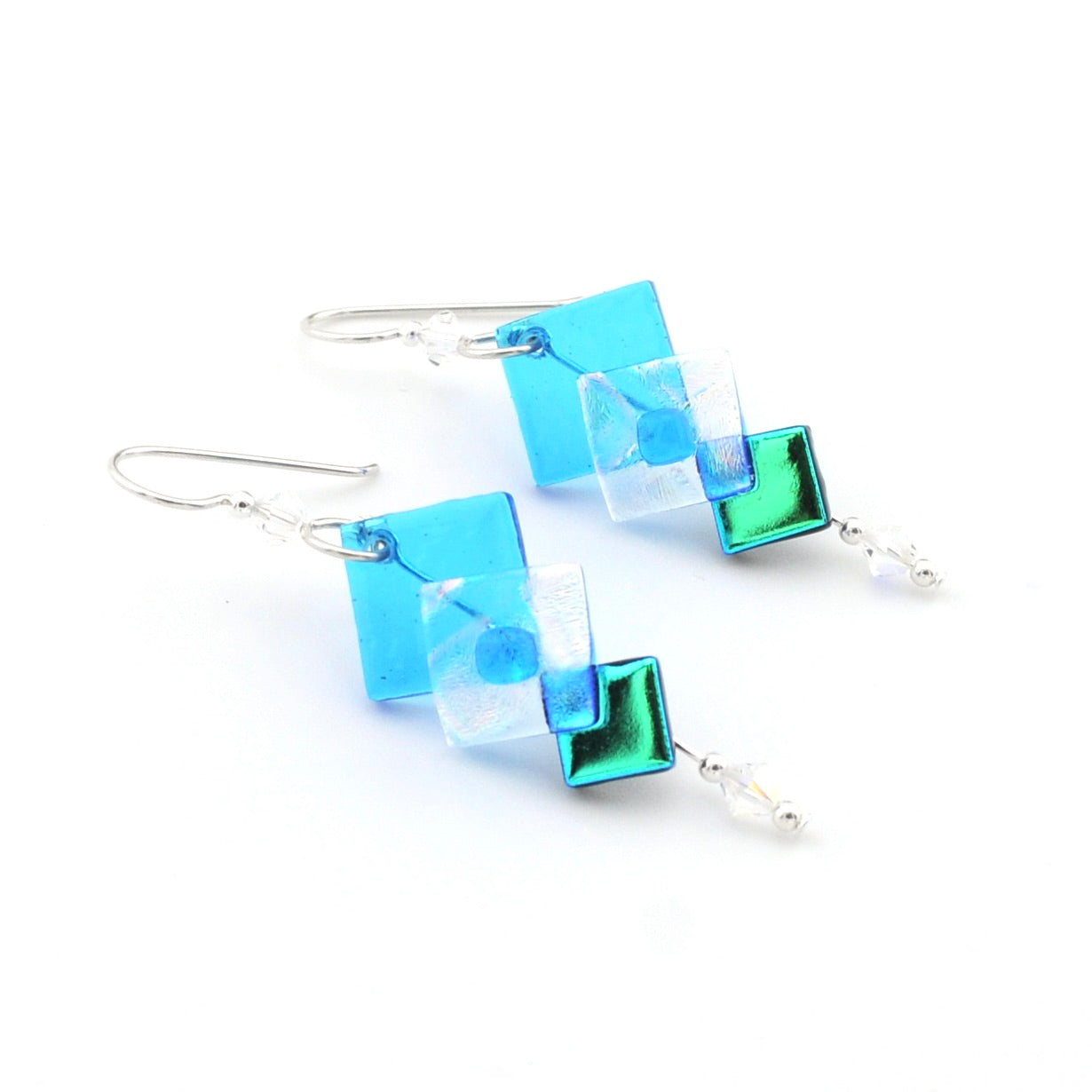 Pair of square-shaped earrings with blue and green iridescent finish on a white background