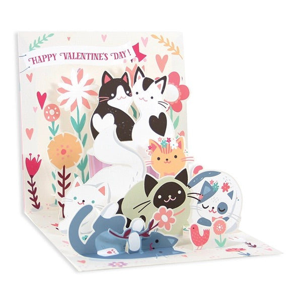 Valentine's Day card with cartoon cats and flowers on a white background
