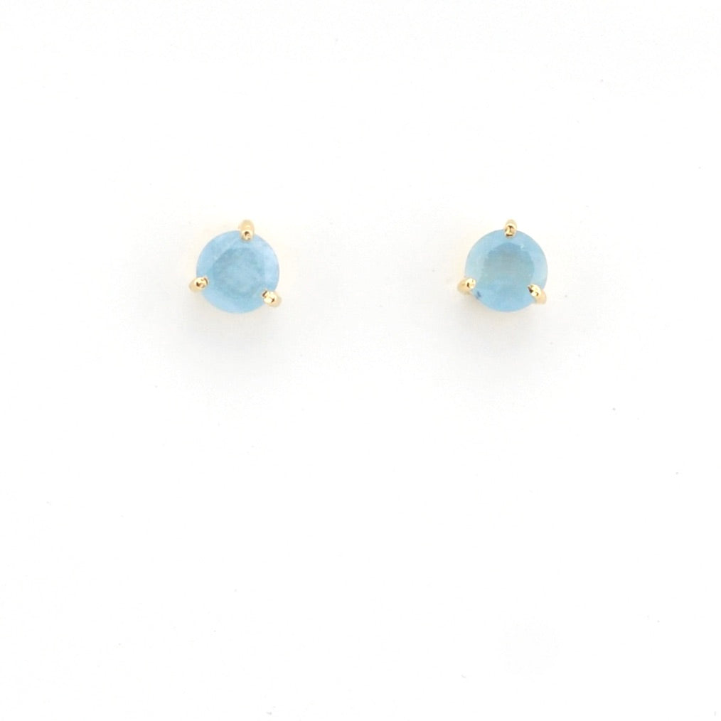 Pair of blue gemstone stud earrings on a white background