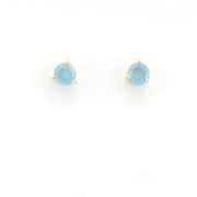 Pair of blue gemstone stud earrings on a white background