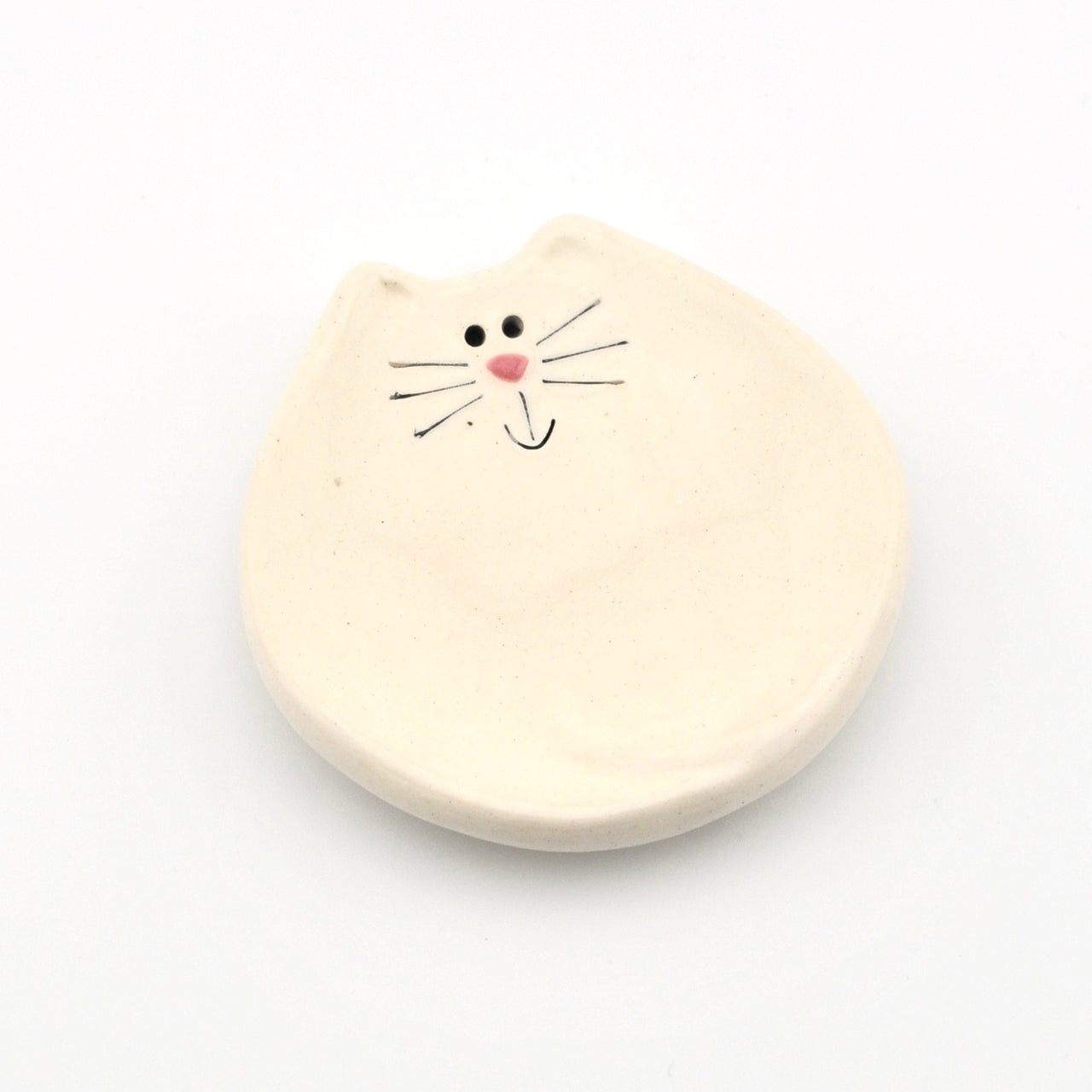 Dish with a cat face on a white background