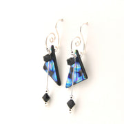 Pair of earrings with blue and black triangular beads on a white background