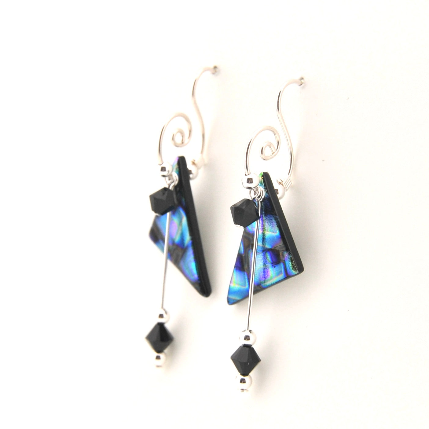 Pair of earrings with blue and black triangular beads on a white background