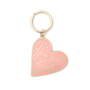 Heart-shaped keychain with 'You are loved' text on a white background