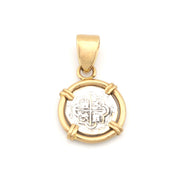 Gold pendant with a circular design on a white background