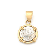 Gold pendant with a circular design on a white background
